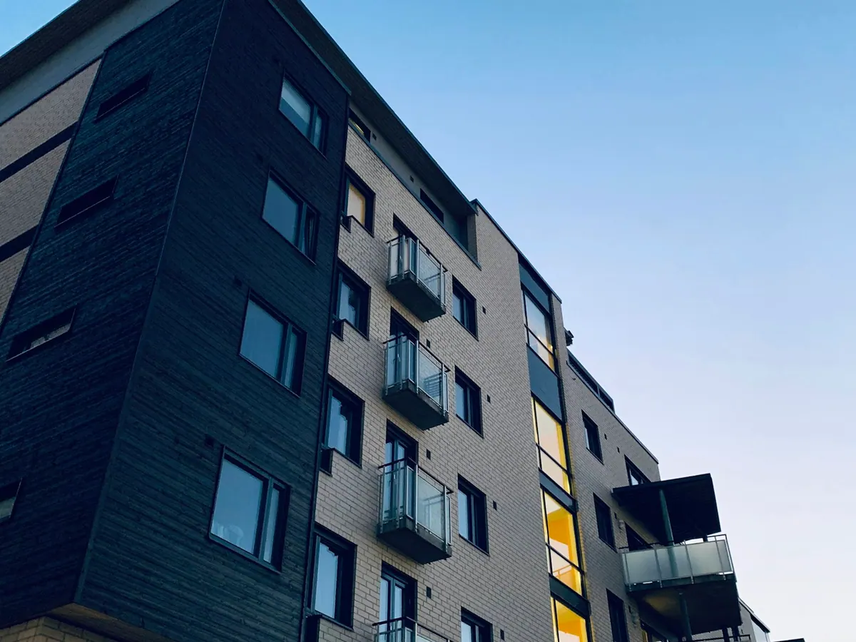 Multi-unit building exterior at dusk